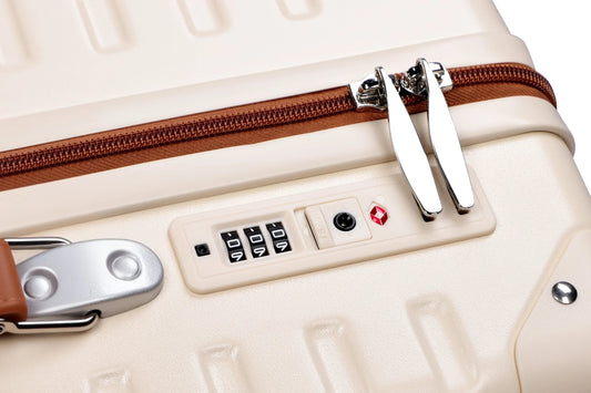 Tavoxda lightweight luggage close-up with secure TSA lock and beige hard shell design